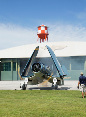 This image shows that the Military Aviation Museum in Virginia Beach features historical aircraft from World War I and II, offering visitors a chance to explore vintage planes and even ride in them during special events.