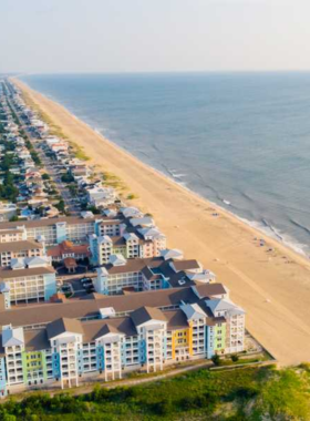 This image shows that Sandbridge Beach provides a quiet, serene environment with stunning sunsets, offering a peaceful escape with miles of untouched shoreline and surrounding natural beauty.