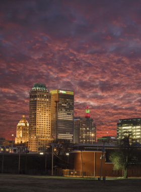 This image shows the Tulsa skyline at night, with illuminated buildings and vibrant lights reflecting the city’s modern and dynamic character.