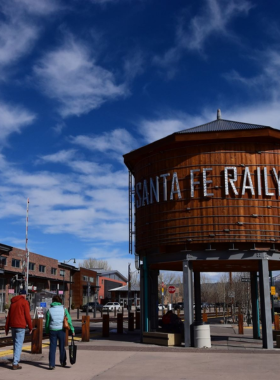 This image shows the Santa Fe Farmers Market, filled with colorful fresh produce, local crafts, and vendors selling New Mexico’s traditional foods and products.