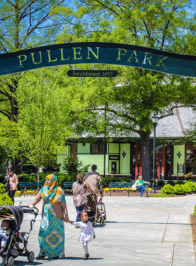 This image shows families enjoying rides on the historic carousel at Pullen Park, emphasizing its vintage charm and family-friendly atmosphere.