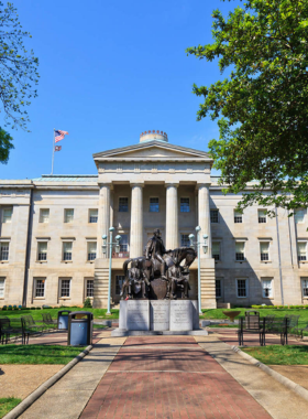 This image shows the grand North Carolina State Capitol building with its impressive Greek Revival architecture, representing its historic significance.