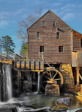 This image shows the historic Yates Mill alongside a tranquil pond, capturing the beauty and heritage of the county park's centerpiece.