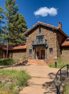 This image shows artifacts and cultural displays at the Museum of Northern Arizona, including pottery, textiles, and interpretive signs.
