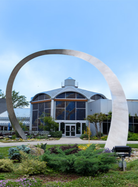 This image shows visitors at the Greensboro Science Center exploring one of the animal exhibits, showcasing a variety of species and offering an educational, interactive experience for guests of all ages.