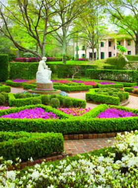 This image shows the Bayou Bend Collection and Gardens, a serene museum and garden located in Houston's River Oaks neighborhood. The historic mansion showcases American decorative arts and beautiful landscaped gardens for visitors to explore.