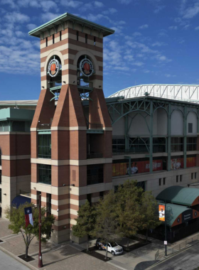 This image shows a baseball game at Minute Maid Park, home of the Houston Astros. The stadium features a retractable roof and hosts exciting games, concerts, and other events, making it a favorite venue for sports fans and visitors.