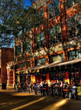 This image shows Market Square in Knoxville, a bustling outdoor space with cafes, shops, and people enjoying the vibrant atmosphere. The historical architecture and modern features blend beautifully, making it a popular destination for locals and tourists alike.