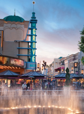 This image shows The Original Farmers Market’s food stalls and The Grove’s stylish shopping area connected by a charming trolley.