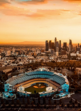 This image shows Dodger Stadium’s vibrant atmosphere during a baseball game, with fans enjoying the energy and scenic city views.