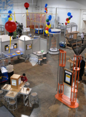 This image shows children interacting with an educational exhibit at the Lancaster Science Factory, encouraging hands-on learning with interactive STEM activities and experiments.