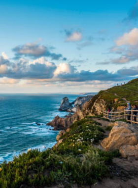 This image shows the breathtaking view of Cabo da Roca, the westernmost point of mainland Europe, with the rugged coastline and vast Atlantic Ocean in the background.