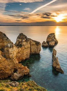 This image shows the stunning Algarve coastline, with dramatic cliffs, golden beaches, and clear blue waters, offering an idyllic escape from Lisbon’s urban life.