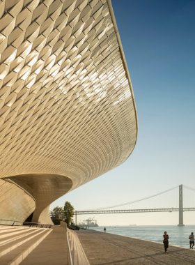 This image shows the modern and futuristic architecture of the MAAT (Museum of Art, Architecture, and Technology) in Lisbon, featuring interactive exhibitions and panoramic views.