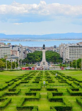  This image shows Eduardo VII Park in Lisbon, a peaceful green space with well-maintained gardens, offering panoramic views of the city and a serene place to relax.

