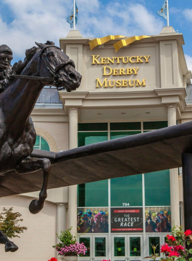  This image shows the Kentucky Derby Museum, with interactive exhibits about the history of the Kentucky Derby, showcasing trophies, memorabilia, and historical artifacts from the race’s past.