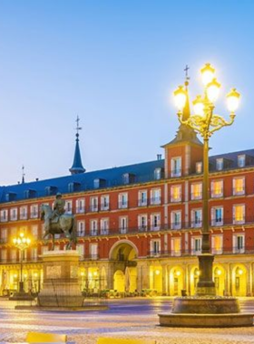 This image shows Plaza Mayor, a historic square in Madrid, surrounded by beautiful arcades and cafes, offering a lively space to enjoy coffee or explore nearby attractions.

