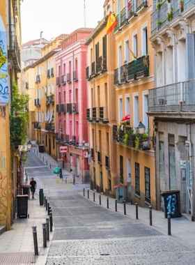 This image shows the Lavapiés neighborhood in Madrid, known for its multicultural atmosphere, vibrant street art, and eclectic mix of cafes, bars, and cultural events.