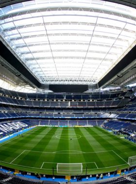  This image shows the Santiago Bernabéu Stadium in Madrid, home to the famous Real Madrid football team, a must-visit for football fans to experience the excitement of live matches and explore the stadium's history.