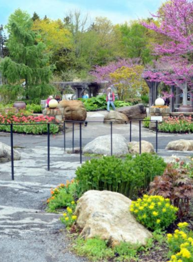 This image shows the vibrant Coastal Maine Botanical Gardens in Boothbay, with beautiful flower beds, lush greenery, and peaceful walking paths that create a perfect nature escape.