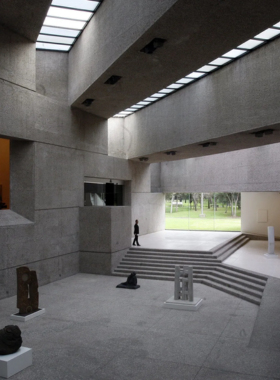 This image shows the modern Museo Tamayo, with its minimalist architecture and vibrant outdoor sculptures. Visitors explore exhibitions of contemporary art, appreciating the creative works of Rufino Tamayo and other renowned artists.