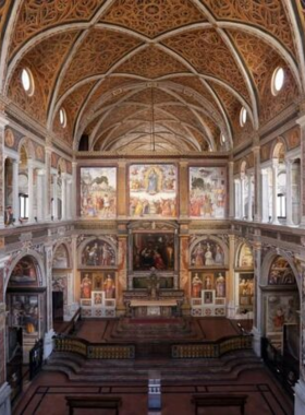 This image shows the Church of San Maurizio, known as Milan’s Sistine Chapel, with its stunning 16th-century frescoes. The church's humble exterior contrasts its ornate and tranquil interior.