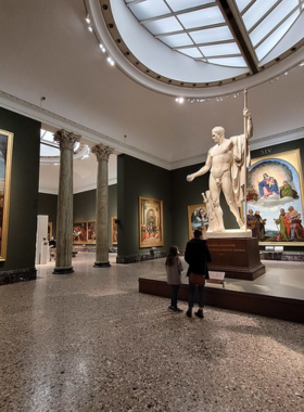  This image shows the Pinacoteca di Brera, an art gallery in Milan featuring works by Raphael, Caravaggio, and Titian. Visitors can explore its masterpieces and the surrounding Brera district, full of charm and vibrant cafes.