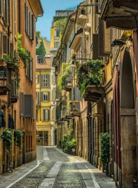  This image shows the Brera District, a charming neighborhood with cobblestone streets, art galleries, boutique shops, and quaint cafes. It’s a perfect place to explore Milan’s artistic and cultural side.