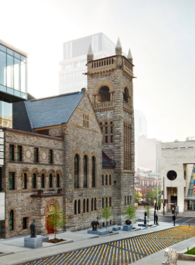 This image shows the interior of the Montreal Museum of Fine Arts, with visitors admiring world-renowned artworks, from ancient masterpieces to contemporary creations.

