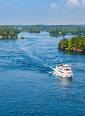  This image shows a scenic cruise on the St. Lawrence River, with Montreal’s skyline in the background, offering passengers a unique perspective of the city’s waterfront.