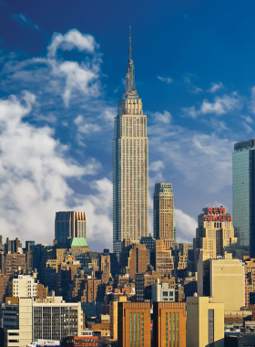 This image shows the breathtaking panoramic views from the Empire State Building’s observation deck. Visitors can enjoy stunning vistas of Manhattan, Central Park, and beyond, day or night, while learning about the building's rich architectural history.