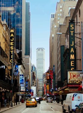  This image shows a live Broadway performance, with actors on stage in a dramatic scene. Broadway is home to world-renowned theater productions, offering visitors a chance to experience top-notch performances in a historic theater district.