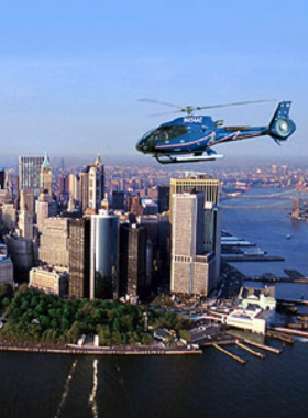 This image shows a thrilling helicopter tour of New York City, providing a bird’s-eye view of iconic landmarks such as the Empire State Building, Central Park, and the Statue of Liberty. It offers a unique and breathtaking perspective of the city's skyline.