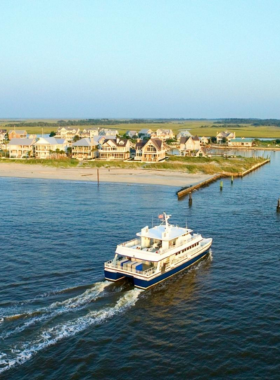 This image shows the tranquil and car-free environment of Bald Head Island, perfect for families and couples to enjoy peaceful walks, beach activities, and nature exploration.