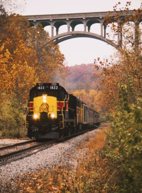 This image shows the Cuyahoga Valley Scenic Railroad passing through lush landscapes, offering travelers a scenic and peaceful journey through the national park.