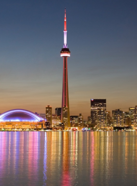 This image shows that the CN Tower offers stunning panoramic views of Toronto, where visitors can enjoy the city's skyline, walk on the glass floor, and even experience the thrilling EdgeWalk.