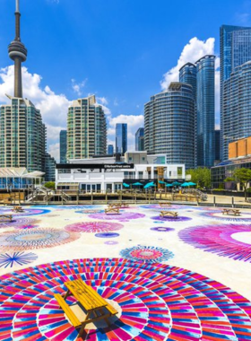 This image shows that the Harbourfront Centre provides visitors with stunning views of Lake Ontario, offering art exhibitions, festivals, and outdoor activities like boating, making it a cultural hub for Toronto residents.