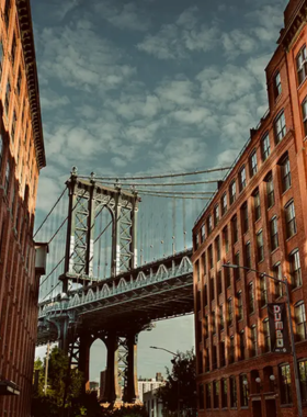 This image shows that the Brooklyn Bridge offers breathtaking views of the Manhattan skyline, East River, and Statue of Liberty, providing a historic and scenic walking experience across the iconic bridge.