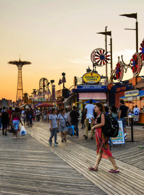 This image shows that Coney Island is a nostalgic amusement destination with classic attractions like the Cyclone rollercoaster, Wonder Wheel, and vibrant seaside atmosphere, perfect for a fun-filled day out.