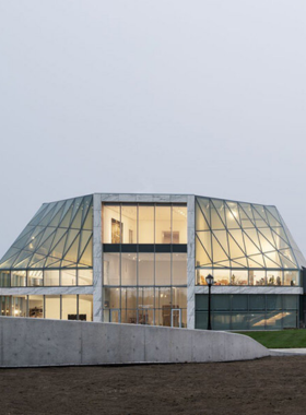 This image shows the modern interior of the Buffalo AKG Art Museum, highlighting a blend of contemporary and classic art, showcasing pieces from renowned artists such as Picasso and Monet.