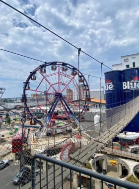 This image shows visitors enjoying thrilling activities at Buffalo RiverWorks, with its exciting mix of live sports, concerts, an urban ropes course, and axe throwing, making it a perfect entertainment venue.