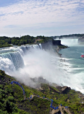 This image shows a breathtaking view of Niagara Falls, one of the world’s most famous natural wonders, showcasing the powerful waterfall and scenic paths surrounding the area.