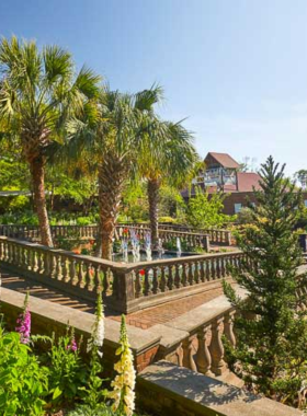 This image shows visitors exploring Riverbanks Zoo and Botanical Garden in Columbia. It highlights the beautiful botanical landscapes and diverse animal exhibits, making it a popular family destination for outdoor fun and education.