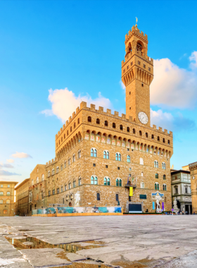 This image shows visitors admiring masterpieces inside the Uffizi Gallery. Paintings by renowned artists like Botticelli and Leonardo da Vinci are displayed in elegant rooms, highlighting the Renaissance's artistic legacy.