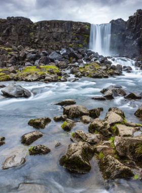 This image shows the stunning rift valley at Þingvellir National Park, where the Eurasian and North American tectonic plates meet, a site of both geological wonder and historical significance.