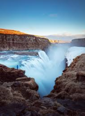 This image shows the majestic Gullfoss waterfall in Iceland, with its two powerful cascades of water flowing into a rugged canyon, a stunning sight on the Golden Circle route. These names and alt texts are informative, descriptive, and designed to be clear for a wide audience.