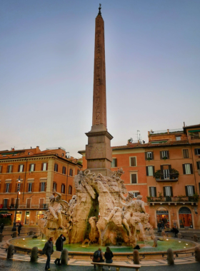 This image shows Piazza Navona, a beautiful square in Rome filled with lively cafes, baroque architecture, and talented street performers. The Fountain of the Four Rivers by Bernini adds to its charm.