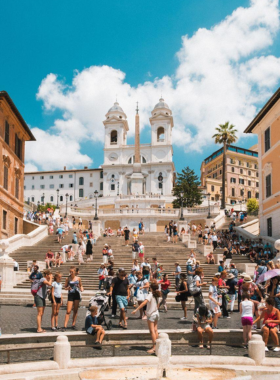 This image shows the famous Spanish Steps in Rome, a popular gathering place for locals and tourists alike. Climbing the 135 steps rewards visitors with breathtaking views of Piazza di Spagna.