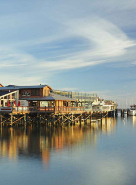 This image shows Old Fisherman’s Wharf in Monterey, with its historic buildings, bustling seafood restaurants, and stunning views of the bay, offering a charming and vibrant atmosphere for visitors to explore.