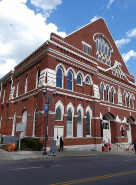 Ryman Auditorium This image shows a concert at the Ryman Auditorium, known as the “Mother Church of Country Music.” The beautiful interior and acoustics offer a magical experience for visitors, showcasing Nashville's deep musical history and the artists who performed here.